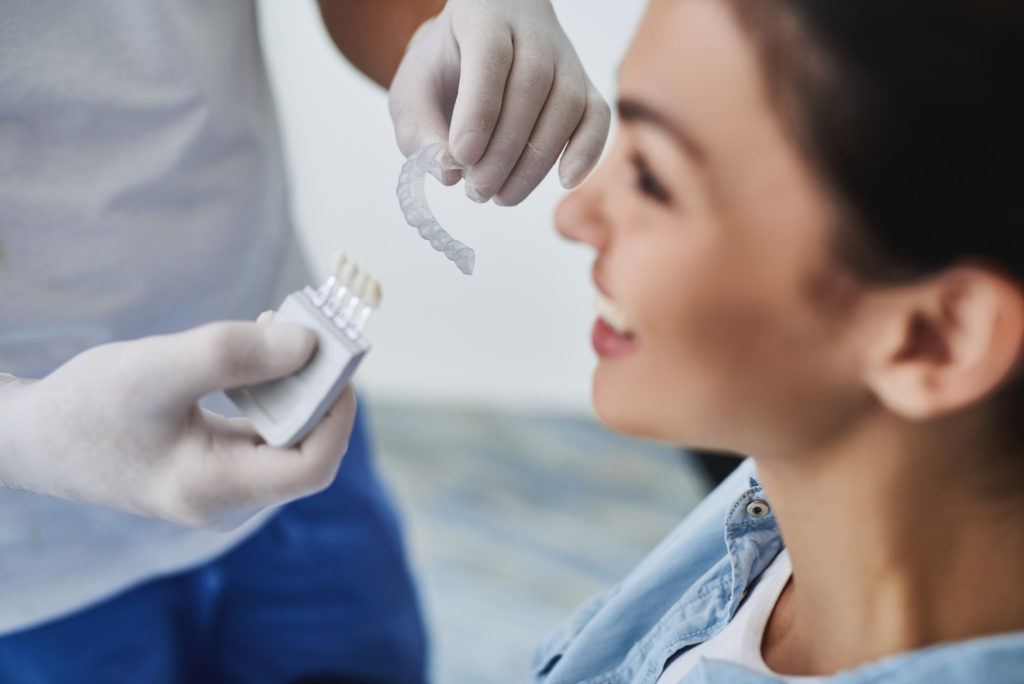 Dentist choosing invisalign braces