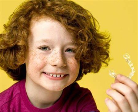 teenage boy with aligners